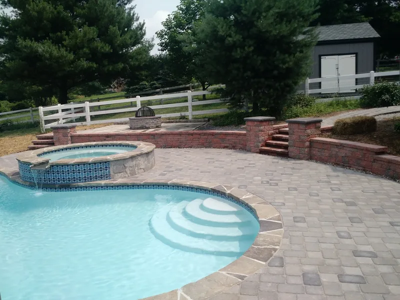 Pool deck, Fire pit, walls. What a fun job.